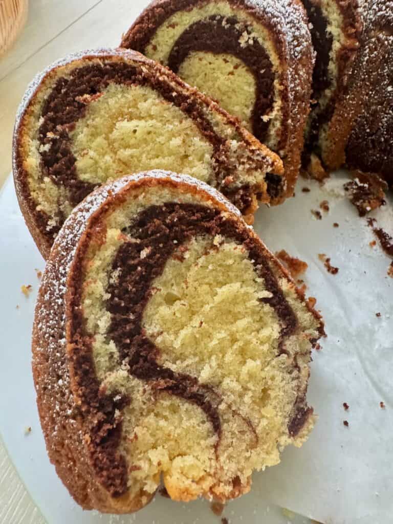 Showing off the chocolate swirls in a vanilla cake.