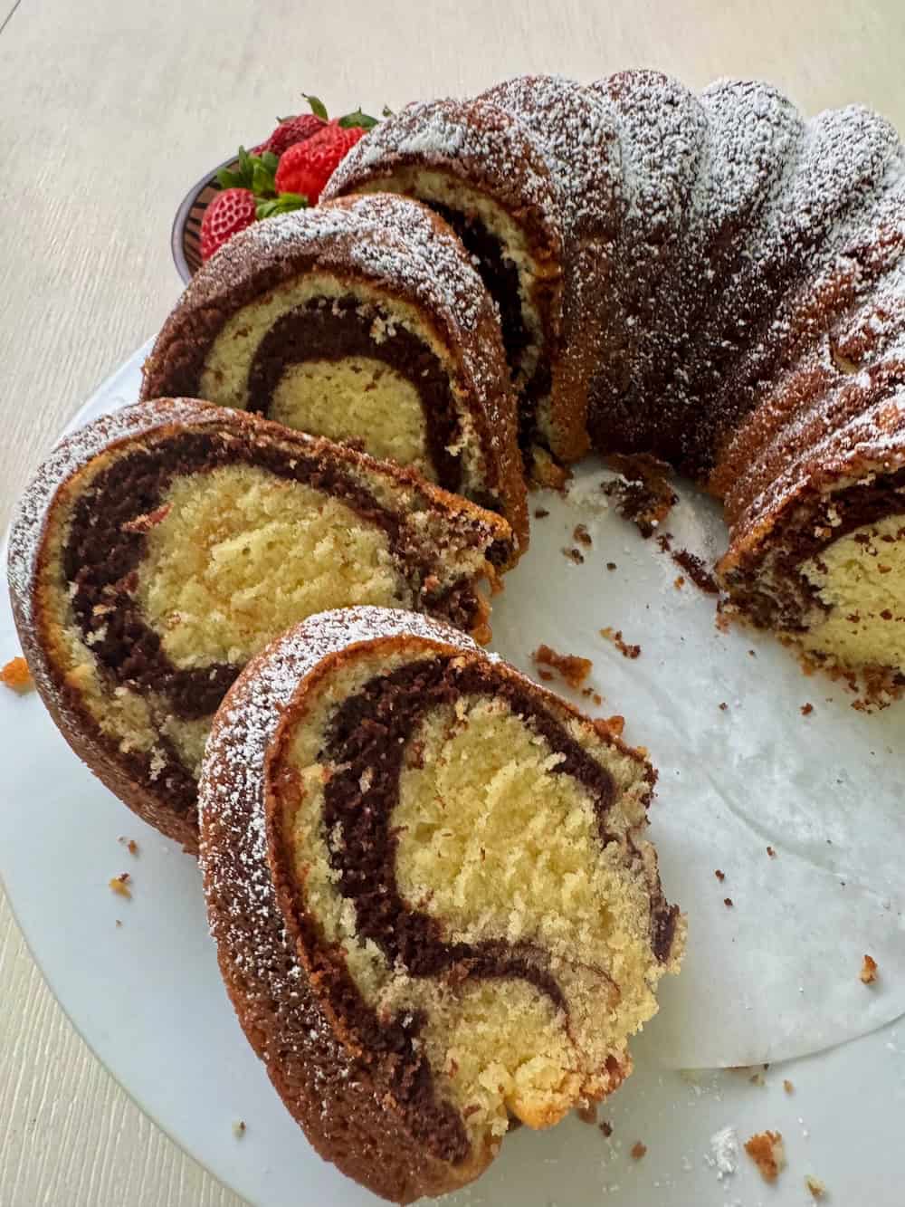 Freshly baked vanilla cake marbled with chocolate swirls.
