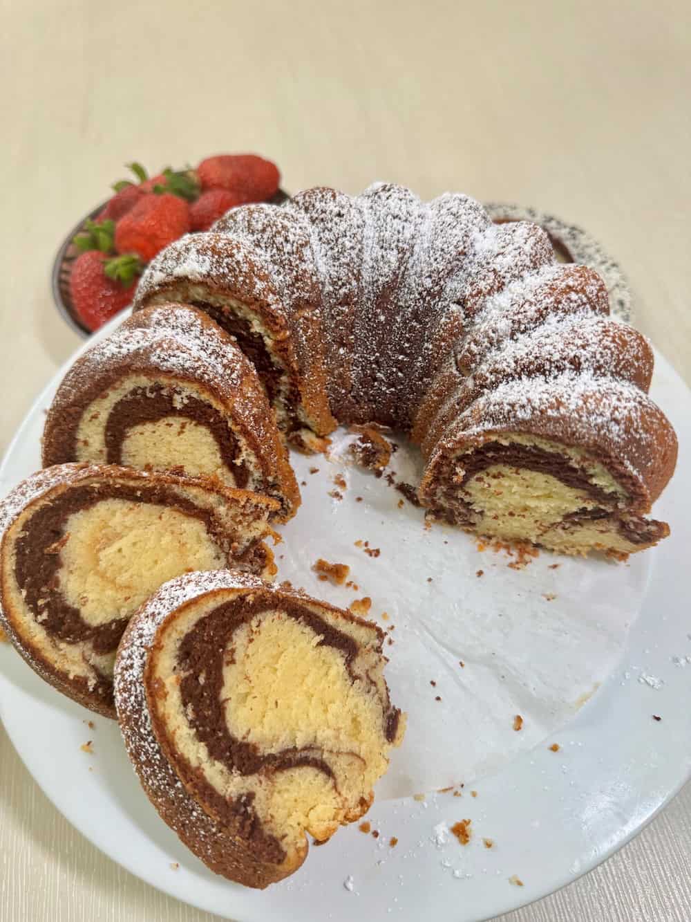 Waiting for the coffee to brew while slicing up a marble cake with chocolate and vanilla.