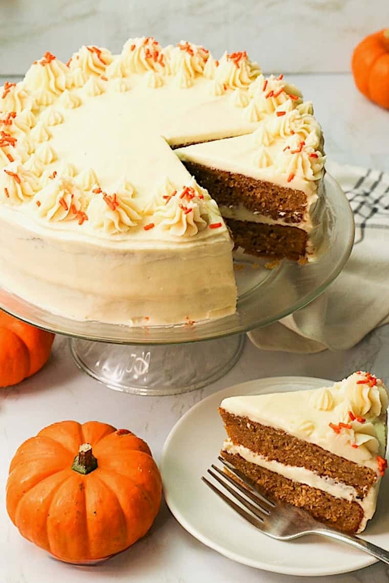 Slicing into a decadent pumpkin cake perfect for the holidays.