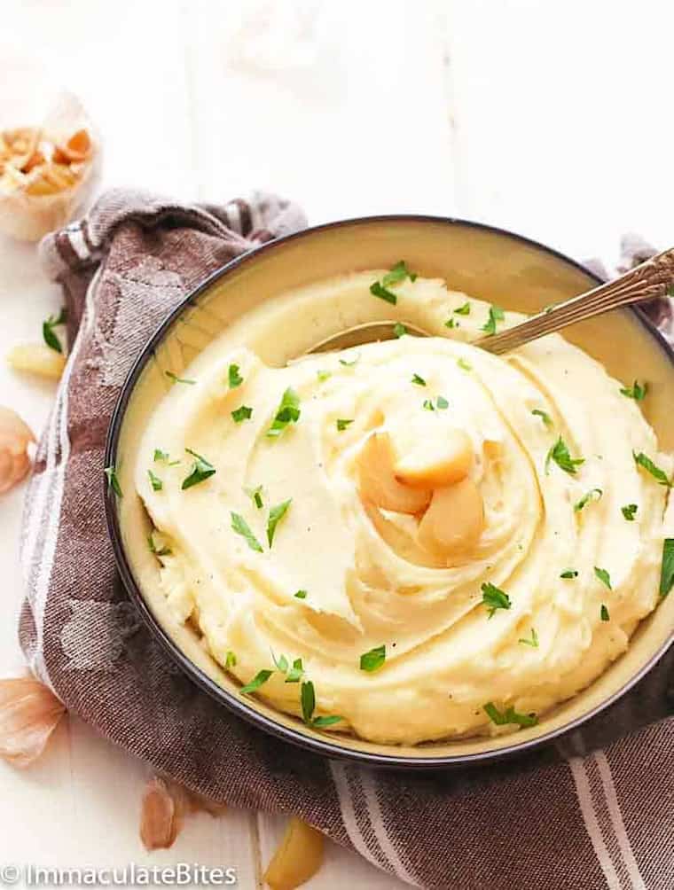 Serving up creamy roast garlic mashed potatoes for Thanksgiving.