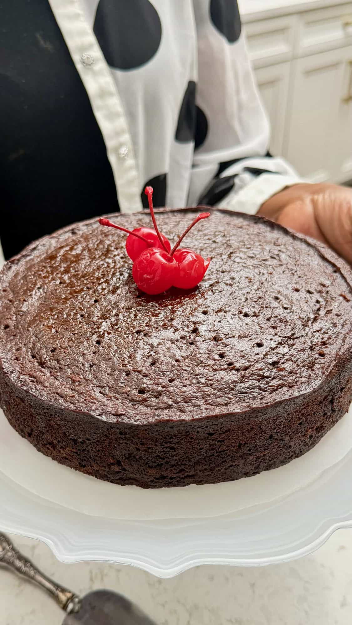 Imma serving up a black cake loaded with dried fruit for Christmas.