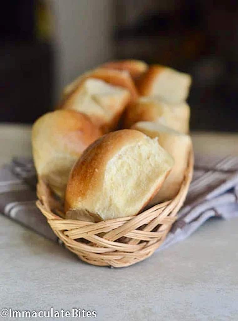 A basket full of freshly baked sweet bread rolls.