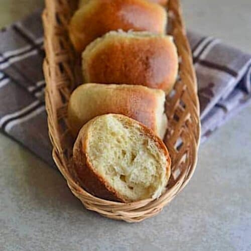 Breaking open a freshly baked sweet bread roll.