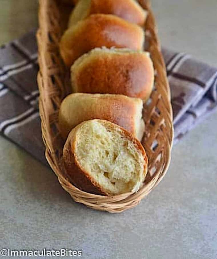 Breaking open a freshly baked sweet bread roll.