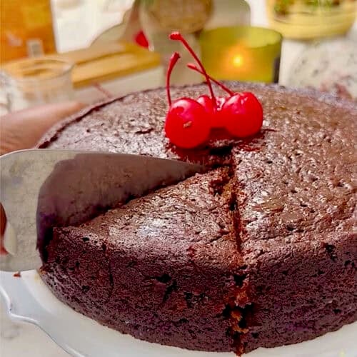 Slicing into a booze fruit cake, Caribbean style.