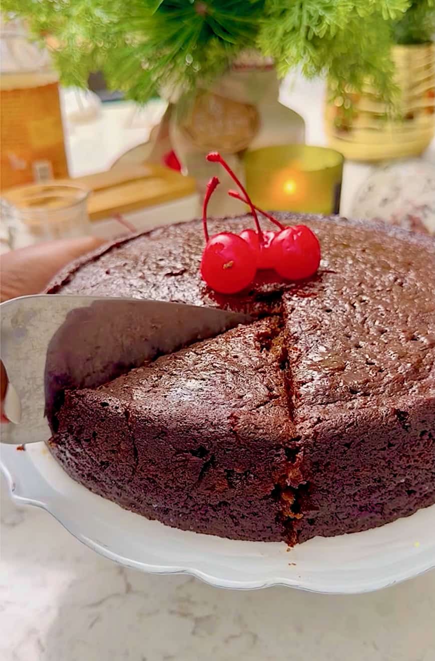 Slicing into a boozy Caribbean fruit cake.