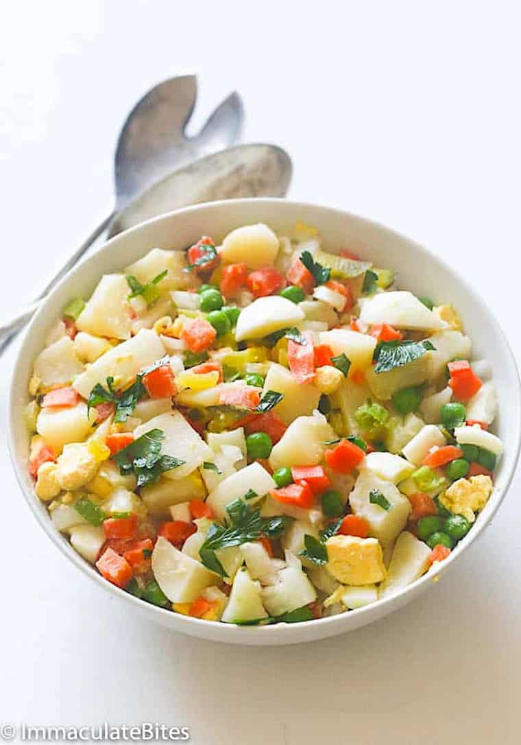 Serving up a bowl full of colorful and flavorful Caribbean potato salad.
