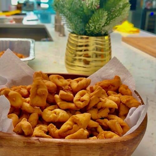 Crispy crunchy chin chin folded into decorate shapes for Christmas.