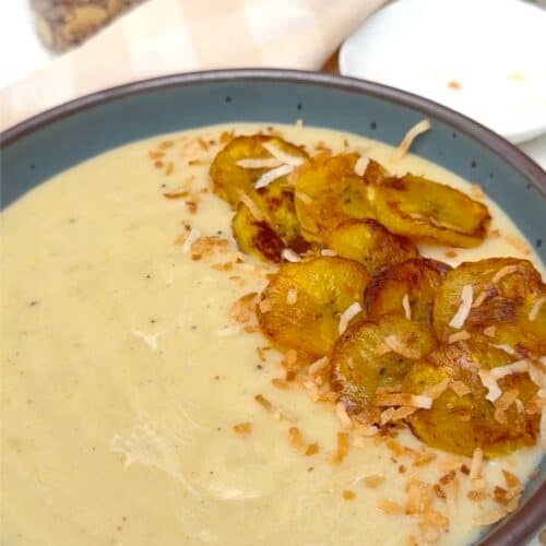 Serving up freshly made Jamaican plantain porridge with fried plantains and coconut.