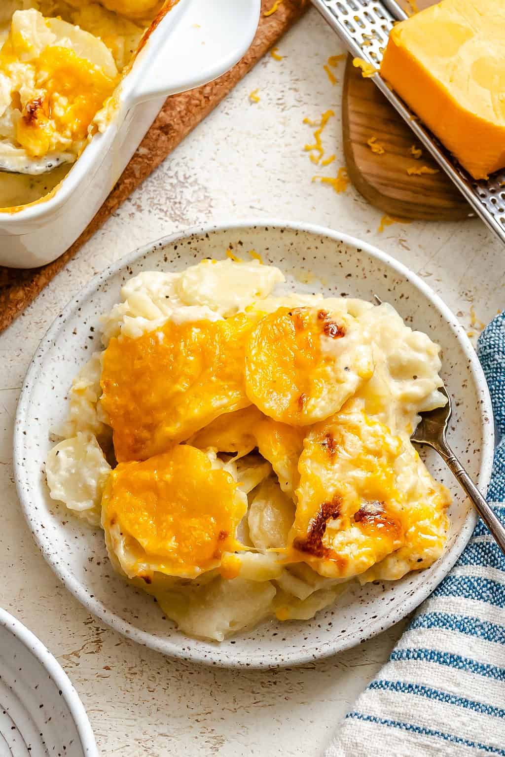 Creamy comfort food potatoes, scalloped and baked in a cream sauce.