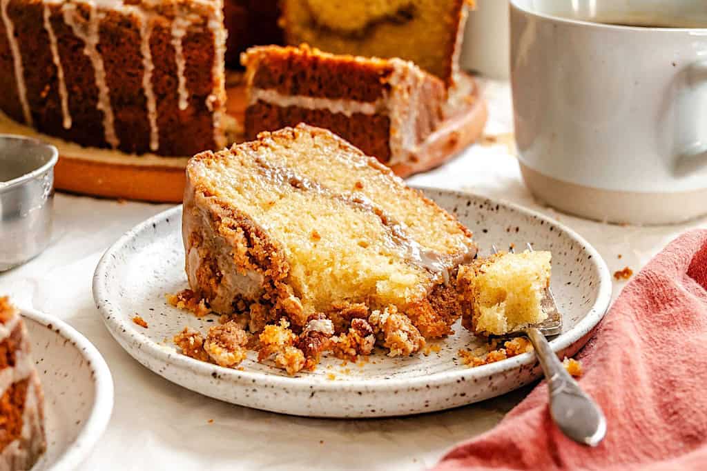 Forking into a decadent slice of coffee cake made even more moist with sour cream.