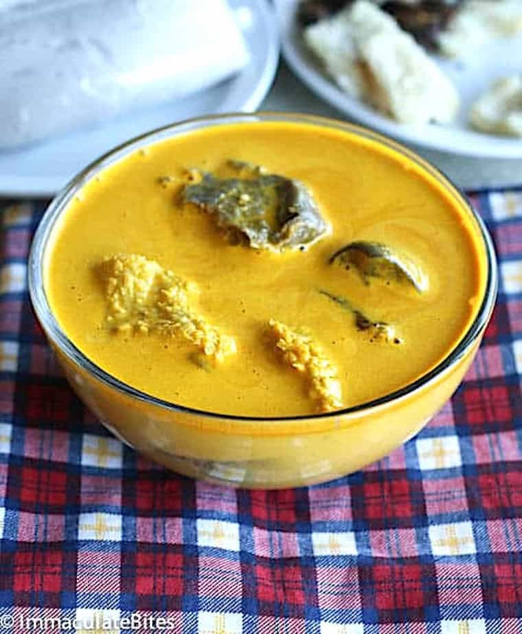 Yellow soup in a bowl and ready to enjoy with achu coco.