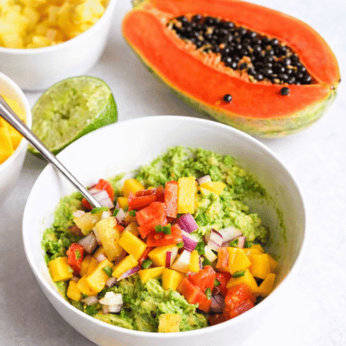 Enjoying fresh flavors from tropical guacamole with papaya, pineapple and mango.