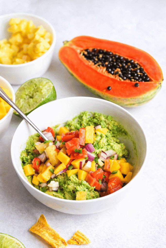 Enjoying fresh flavors from tropical guacamole with papaya, pineapple and mango.