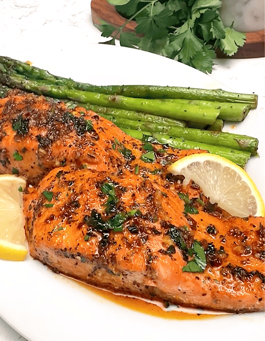 Serving up freshly baked salmon with roasted asparagus.