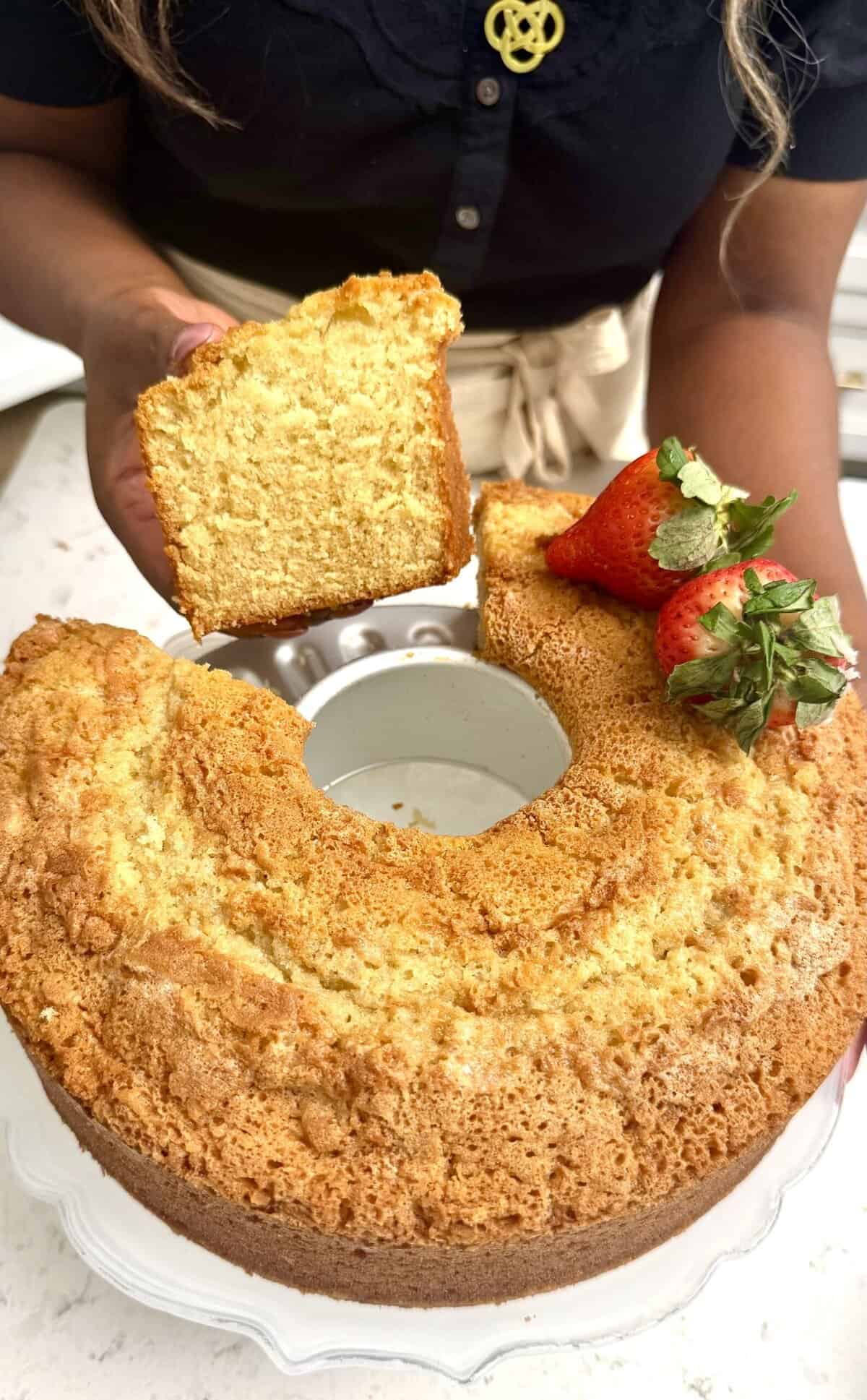 Taking a slice of a classic pound cake for a sweet treat.