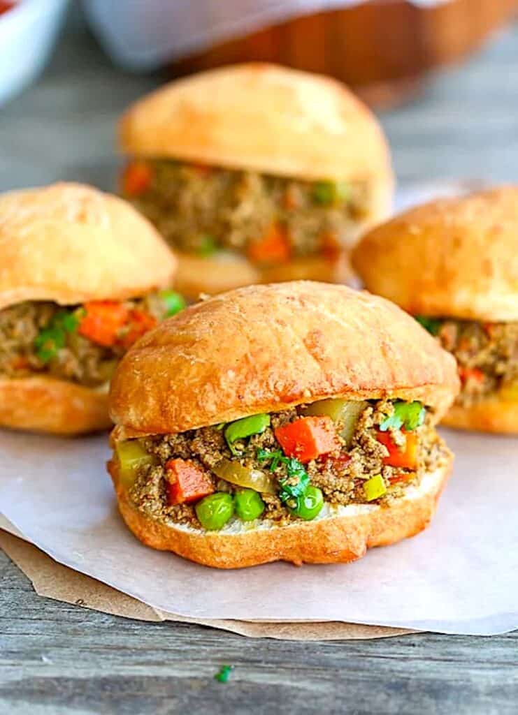 Freshly assembled vetkoek with the minced curry meat.