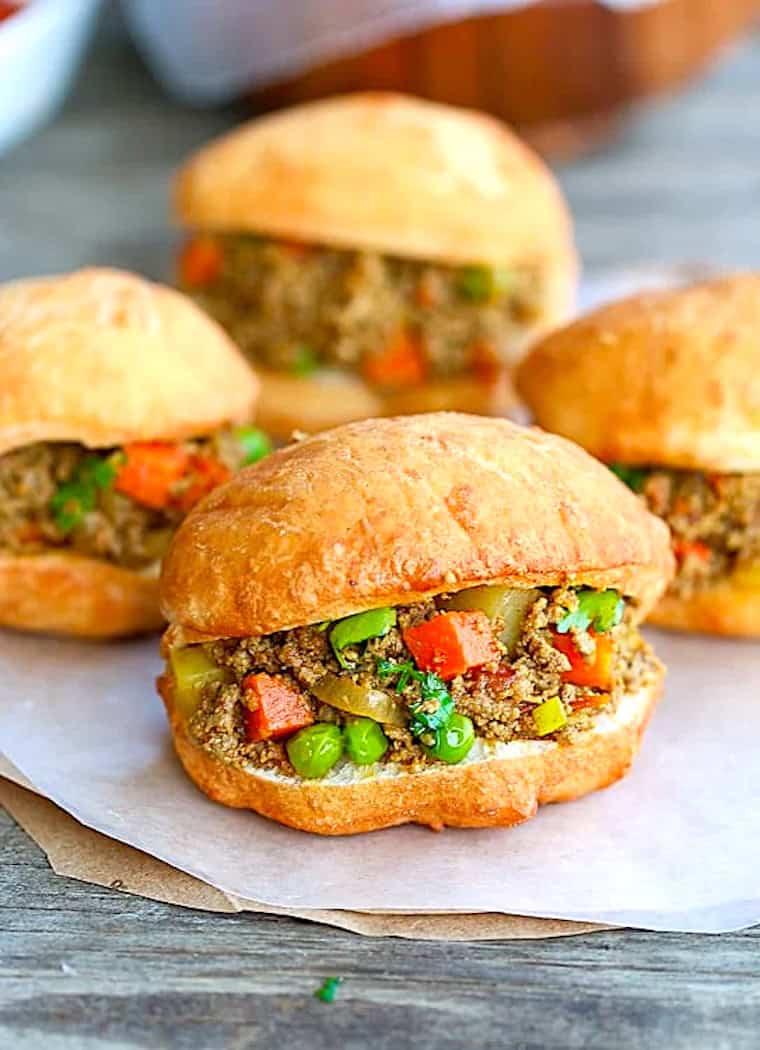 Freshly assembled vetkoek with the minced curry meat.