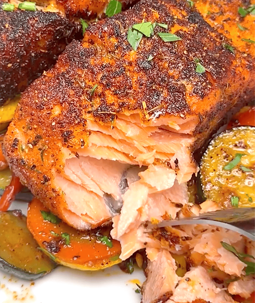 Forking into a flaky, tender salmon fillet spiced up with blackening.
