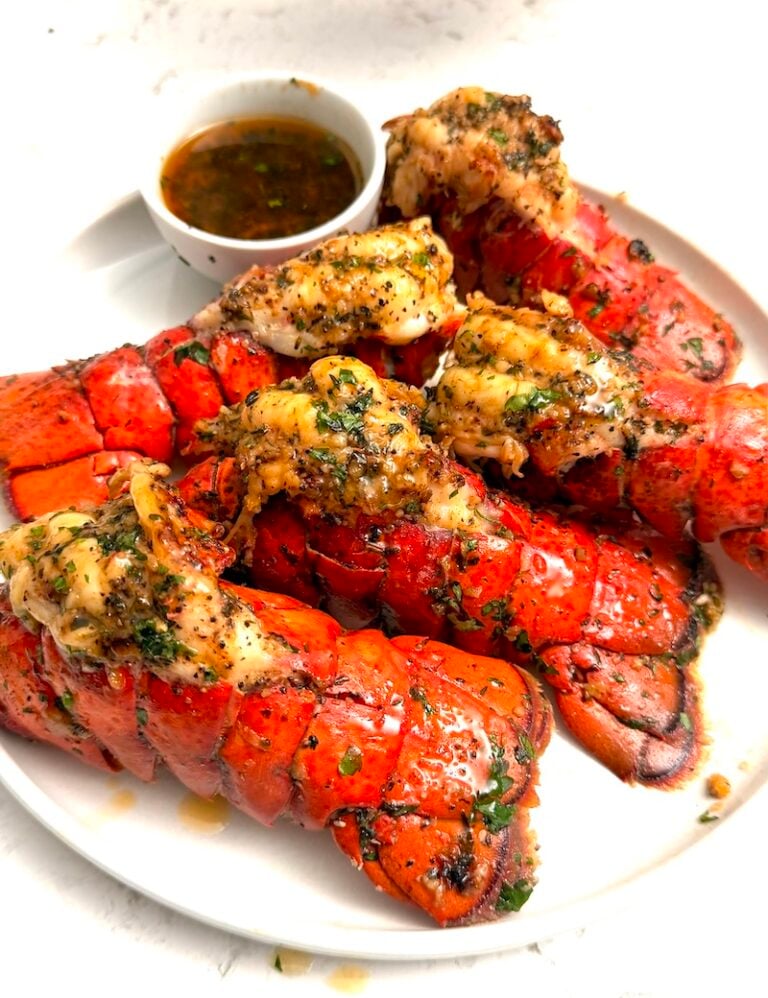 Enjoying decadent restaurant-quality broiled lobster tails in the comfort of home.