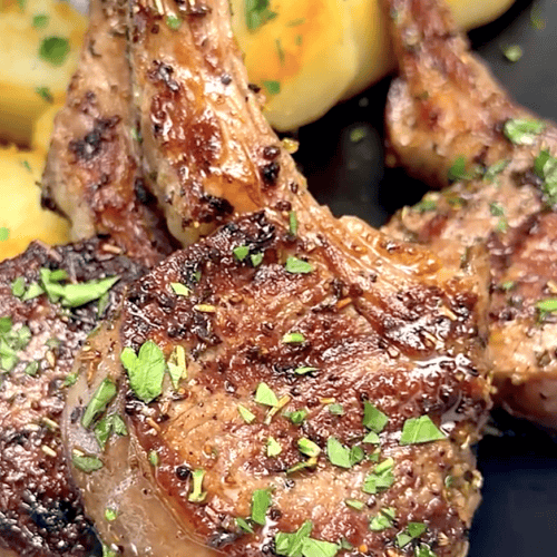Serving freshly grilled lamb chops with peppercorn sauce.
