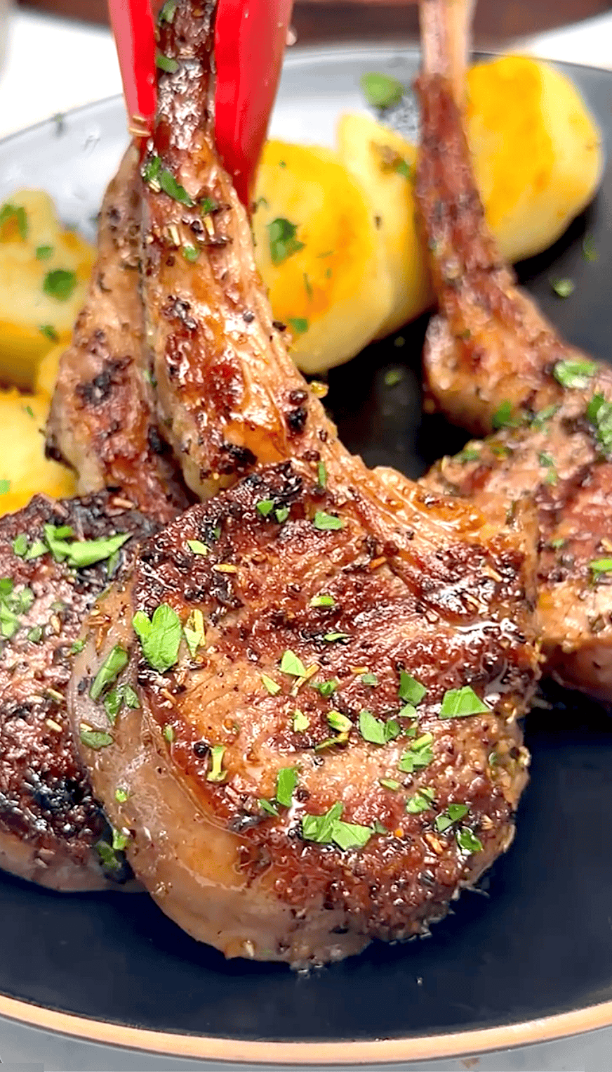 Serving freshly grilled lamb chops with peppercorn sauce.