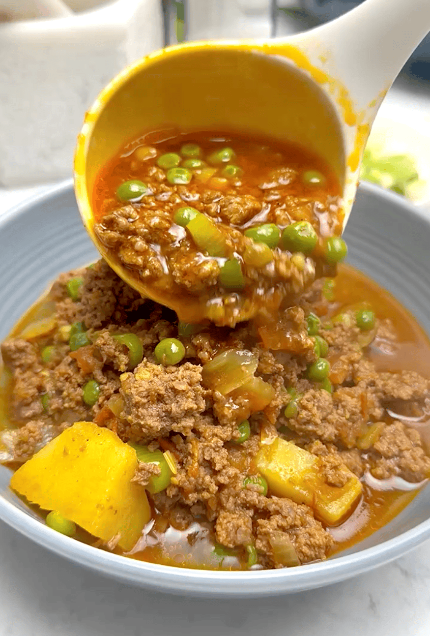 Getting ready to enjoy curry made with ground beef and potatoes.