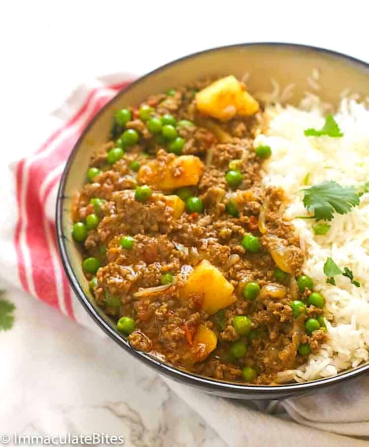 Serving healthy curried ground beef and potatoes over basmati rice.