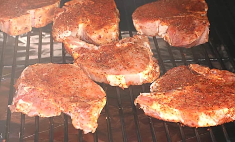 Smoking perfectly seasoned pork chops for a family cookout.