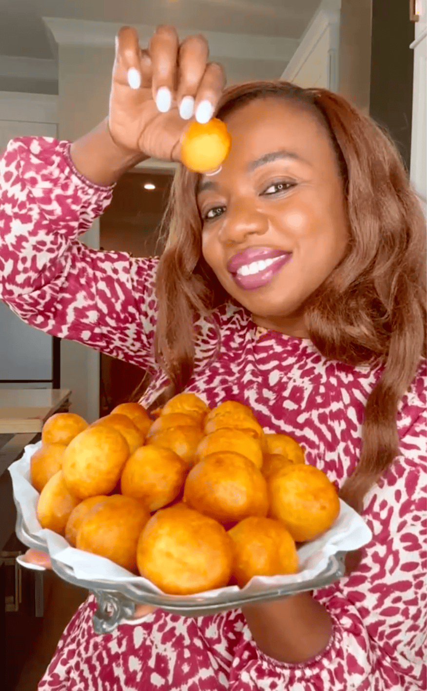 Showing off my fresh, homemade puff puff.