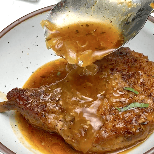 Drizzling tender, juicy pork chops with onion gravy.