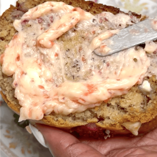Slathering a slice of freshly made banana bread with strawberry butter.