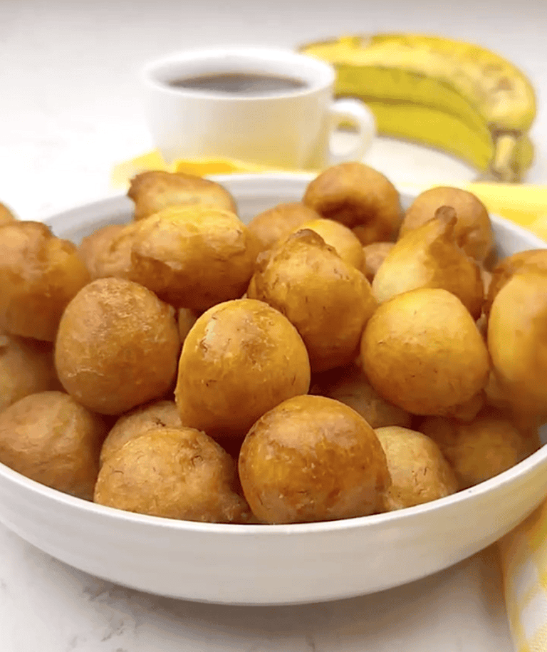 A bowl full of West African banana puff puff for a comfort food treat.