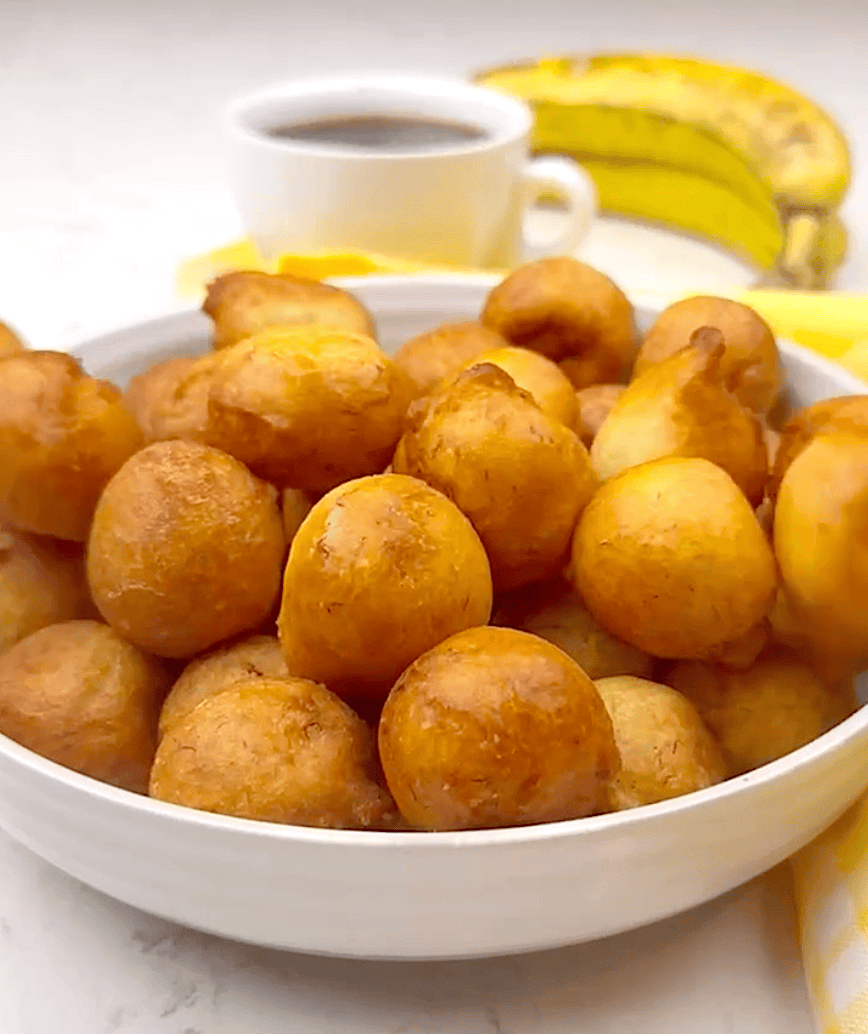 A bowl full of West African banana puff puff for a comfort food treat.