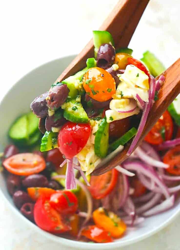 Serving up a refreshing and healthy Greek salad for a guilt-free side.