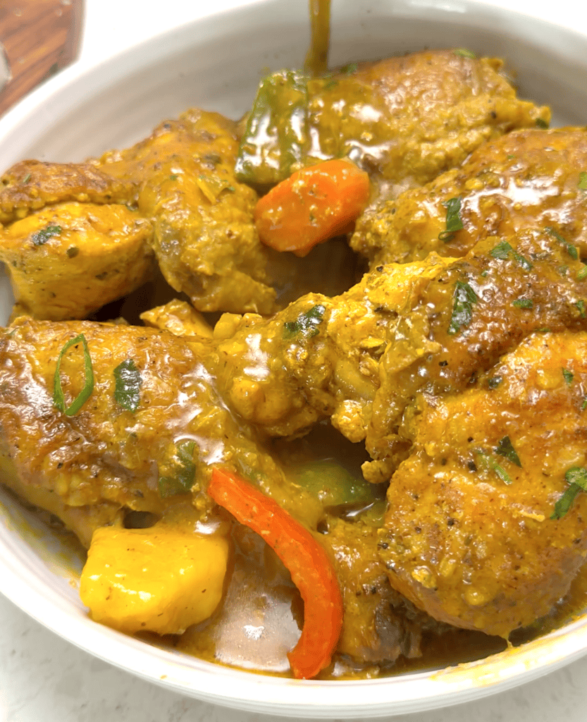A comforting bowl of Jamaican curry chicken ready to satisfy your soul.