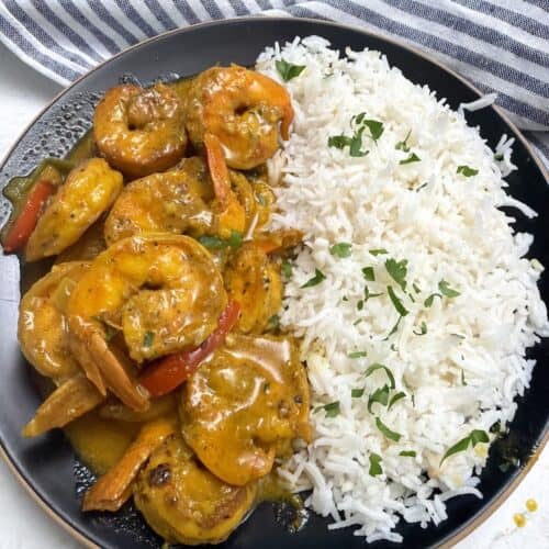 Jamaican curry shrimp stew with coconut rice for a Caribbean comfort food meal.