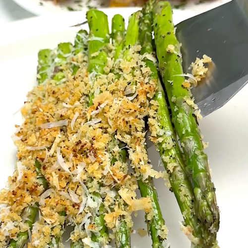 Serving up freshly baked asparagus topped with a cheesy breadcrumb topping.