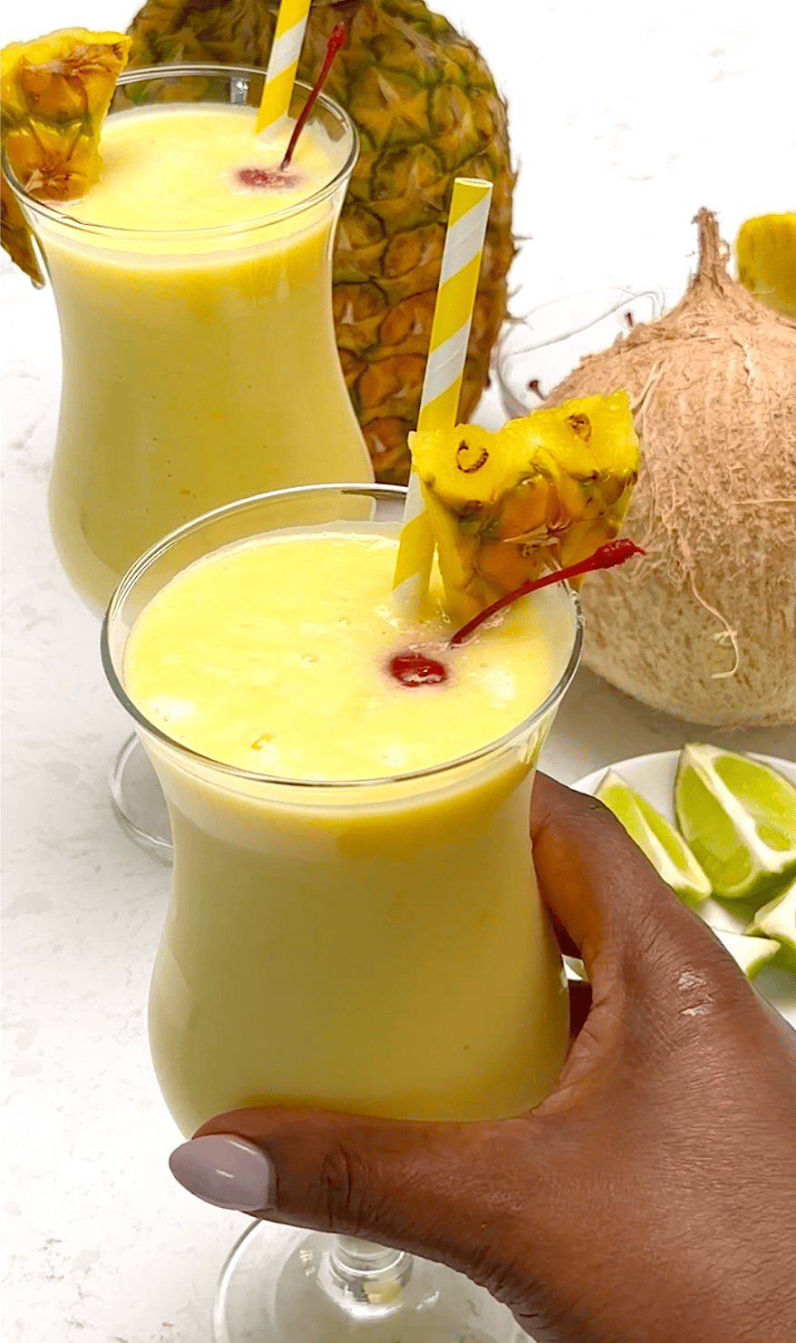 Diving into a chilled pina colada for a tropical cocktail.