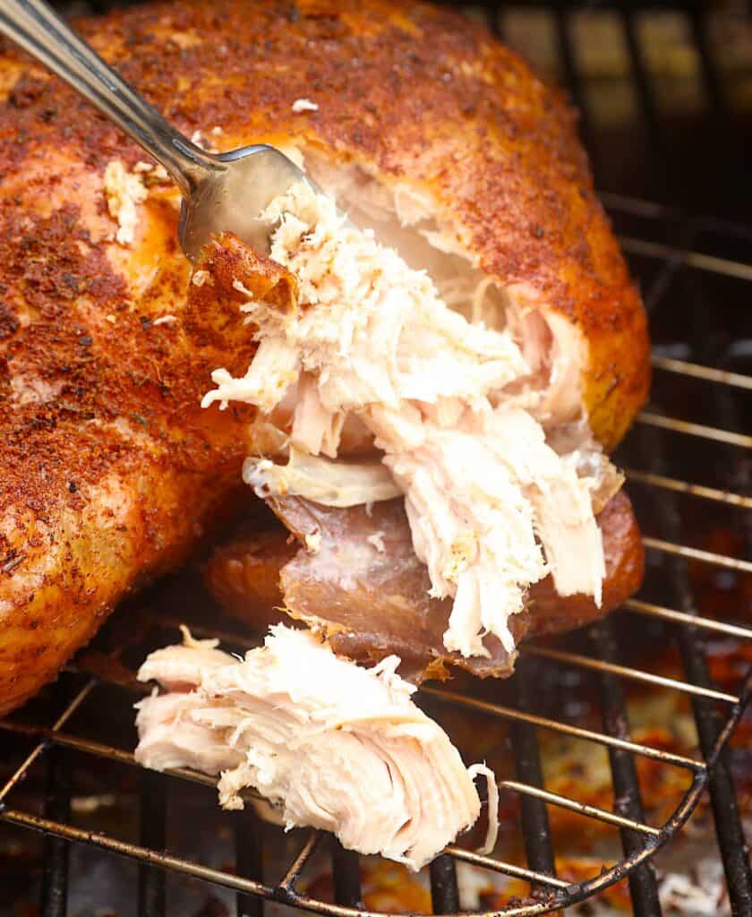Getting ready to serve smoked pulled chicken for an easy cookout main dish.