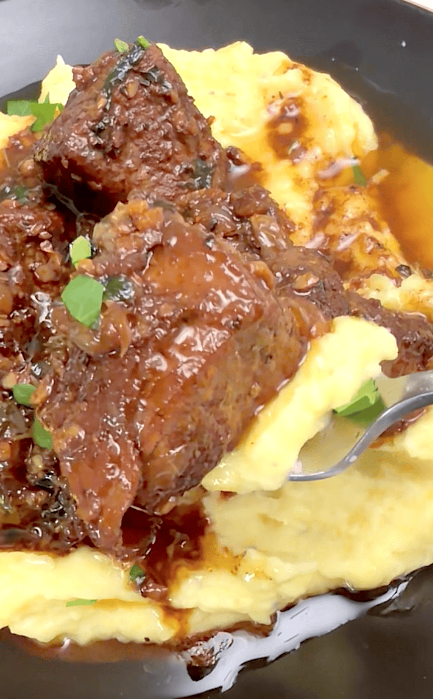 Forking into beef tips and mashed potatoes smothered in a rich gravy.