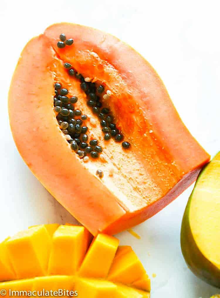 Cutting the mango and papaya for a fruit salad.
