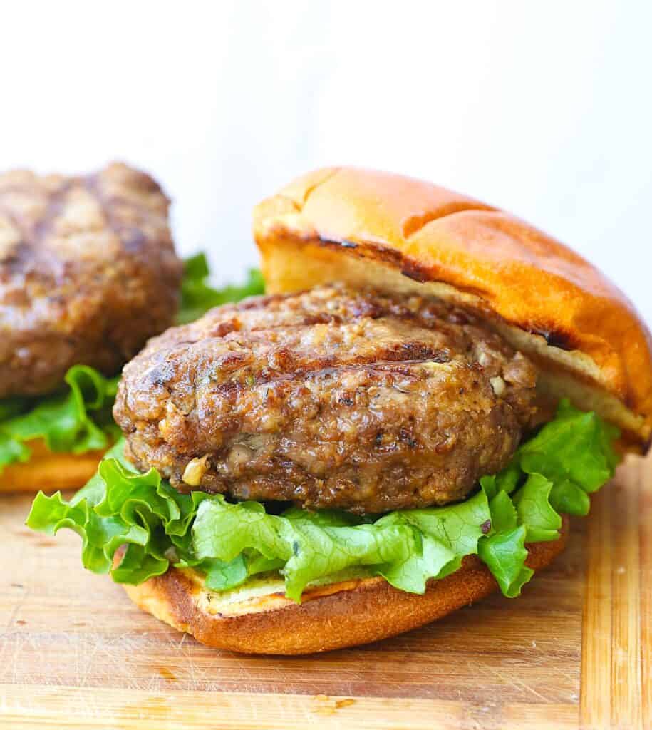 A freshly grilled beef brisket burger waiting to be devoured.