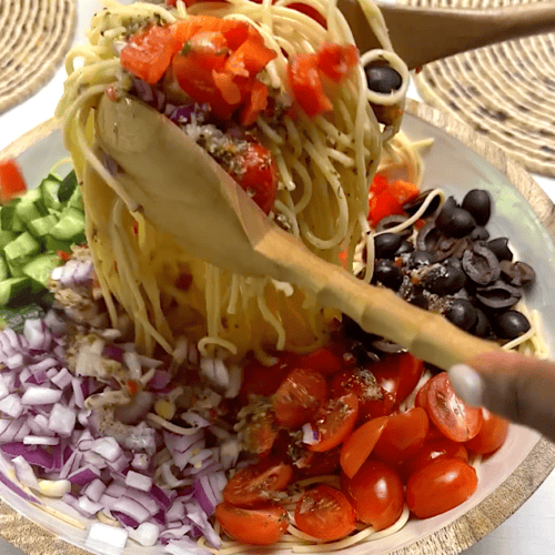 Toss the salad in the dressing, then chill it.