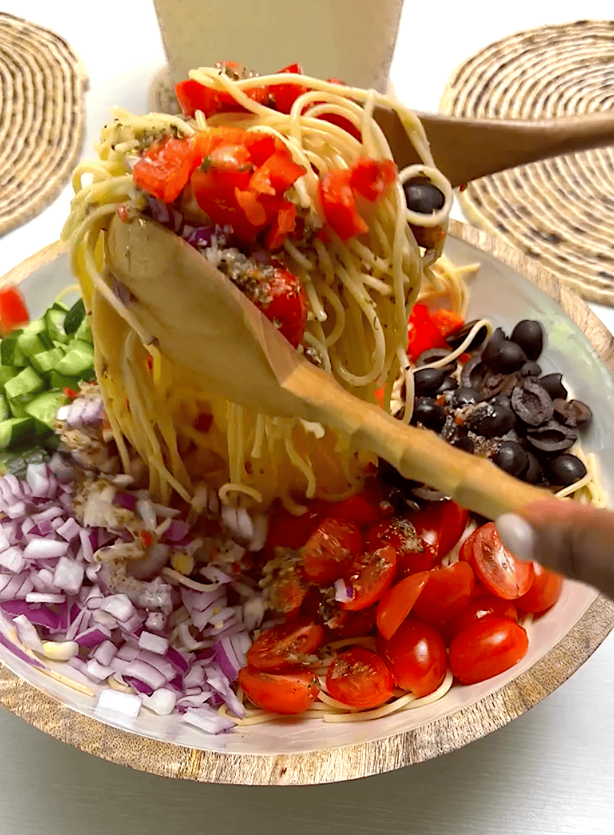 Toss the salad in the dressing, then chill it.