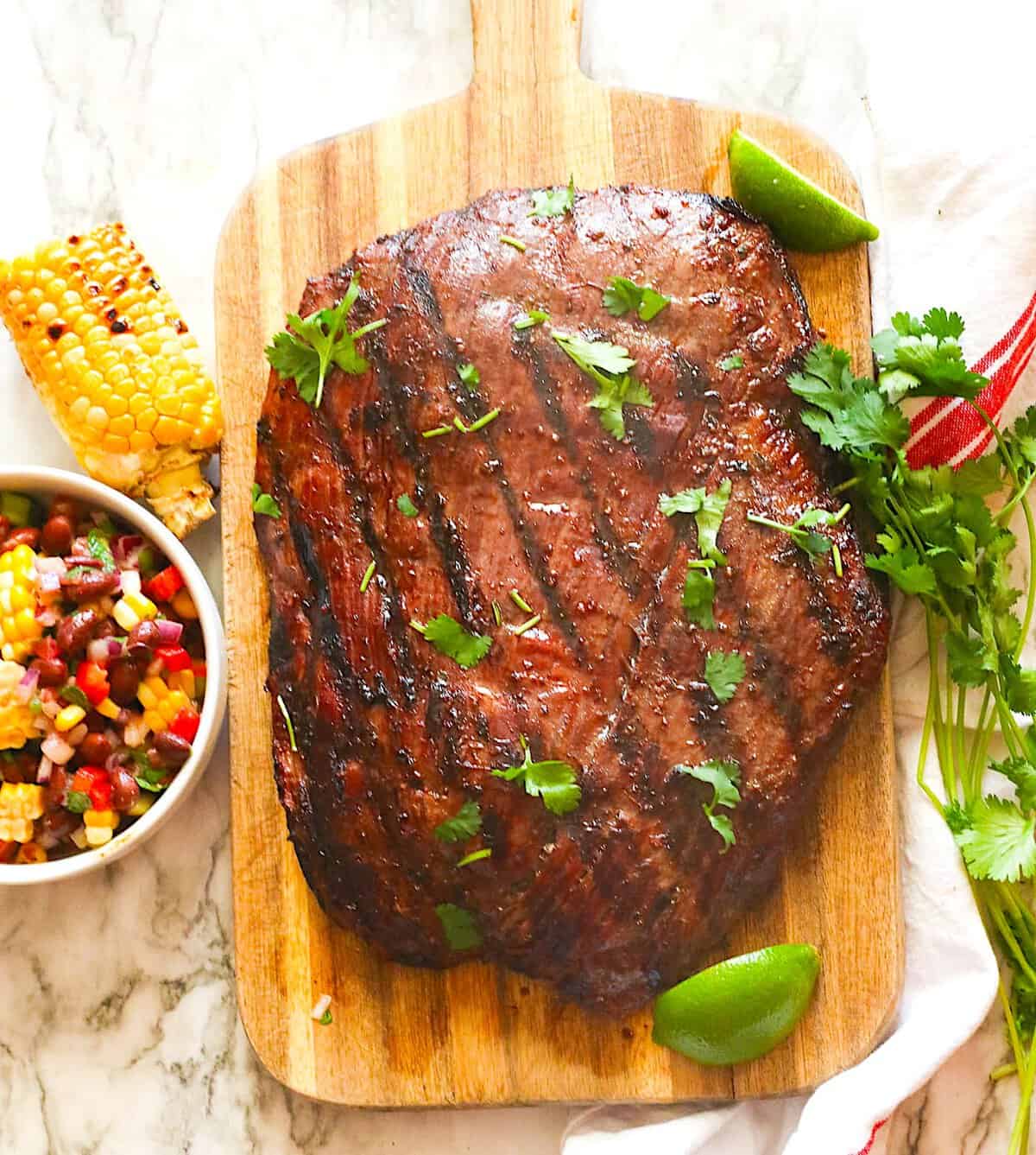 A freshly smoked and marinated flank steak ready for making tacos.