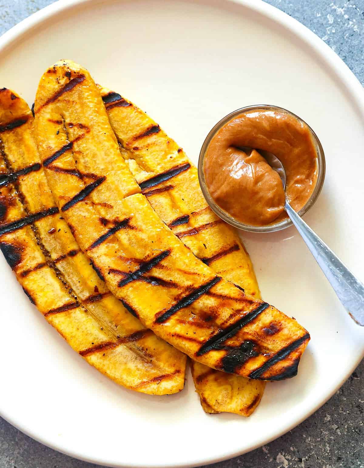 Serving up plantains fresh from the grill with a peanut butter honey sauce.