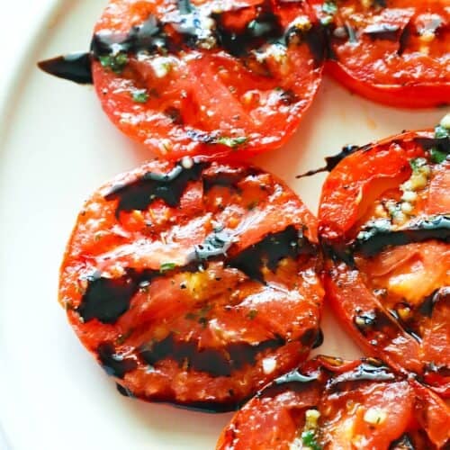 Tomatoes, marinated and grilled, then drizzled with a balsamic glaze.