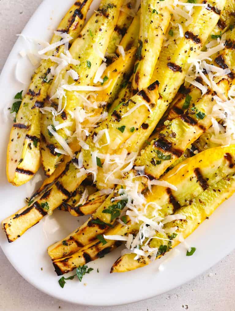 Freshly grilled yellow squash sprinkled with freshly grated Parmesan for a summer favorite.